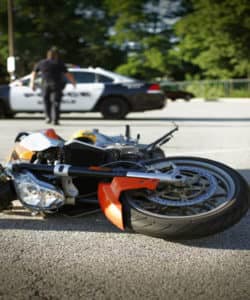 motorcycle laying on the floor after crash