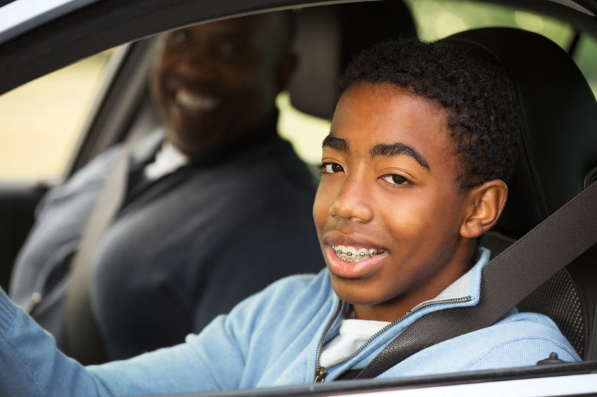 Teenager driving with 5 to drive rules in mind.