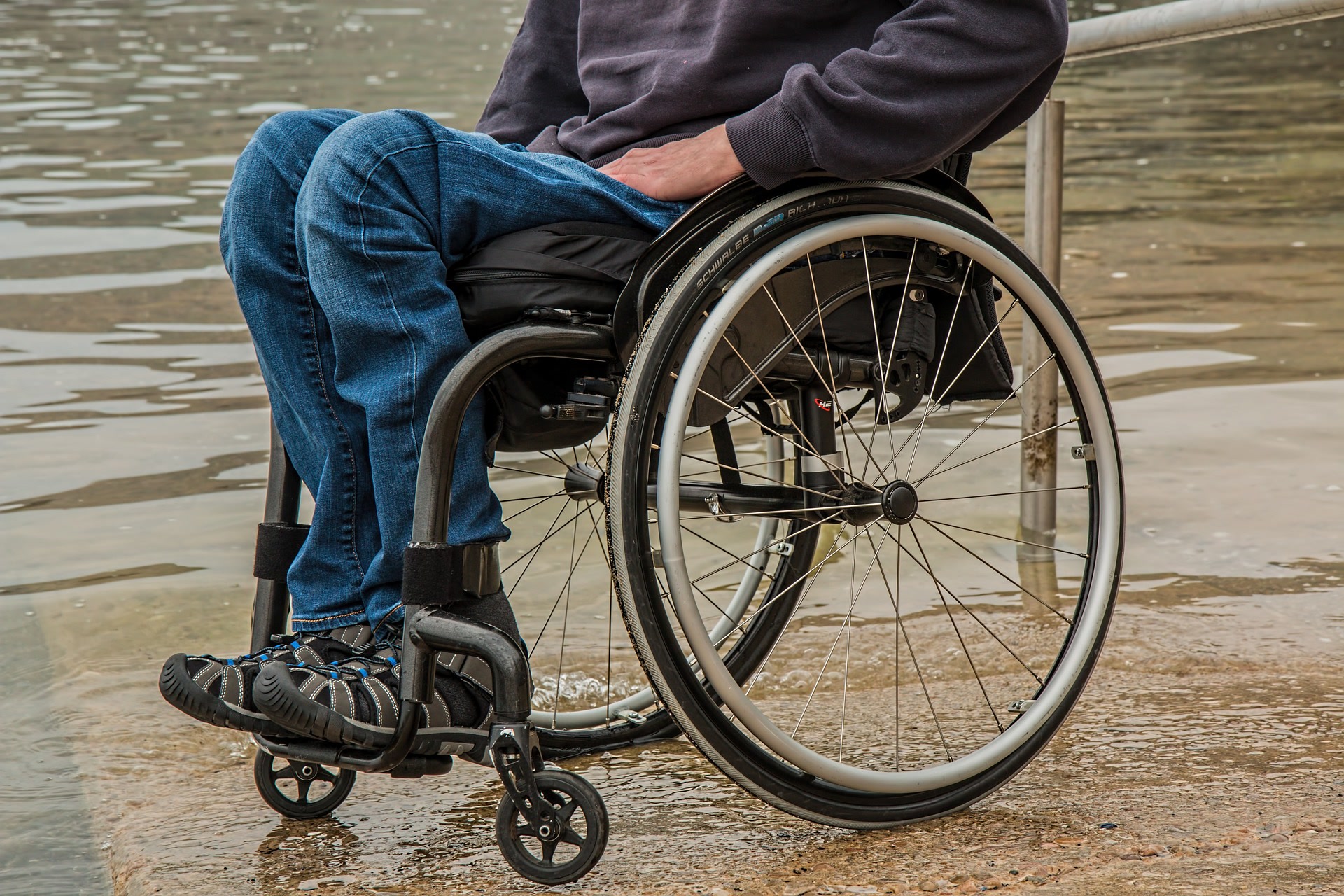 Man in wheelchair applying for disability benefits