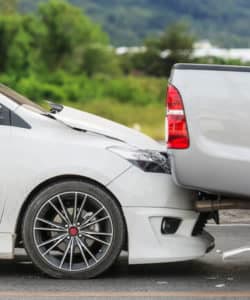 accident caused when two cars collided at a red light