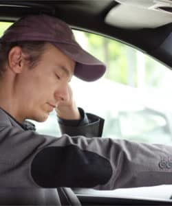 man falling asleep at the wheel