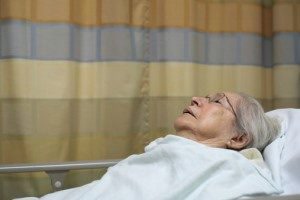 nursing home patient in bed